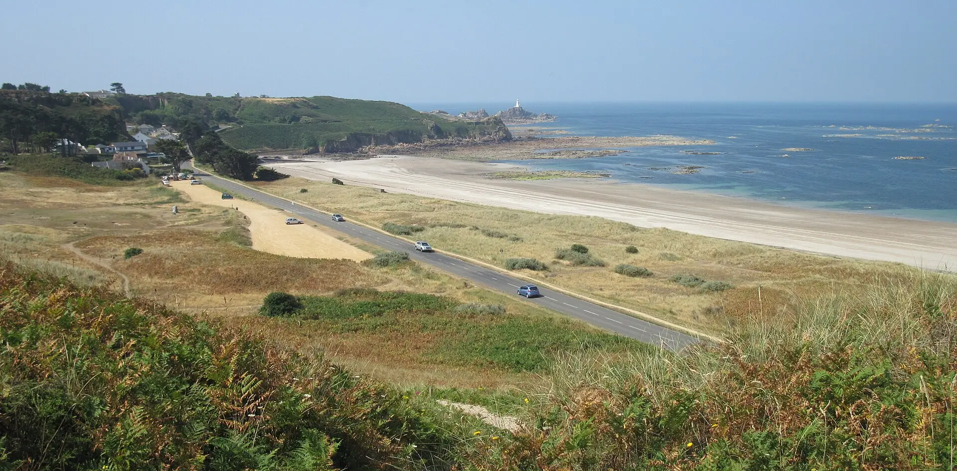 St Ouen's Bay from above, with the Five Mile Road running beside the dunes